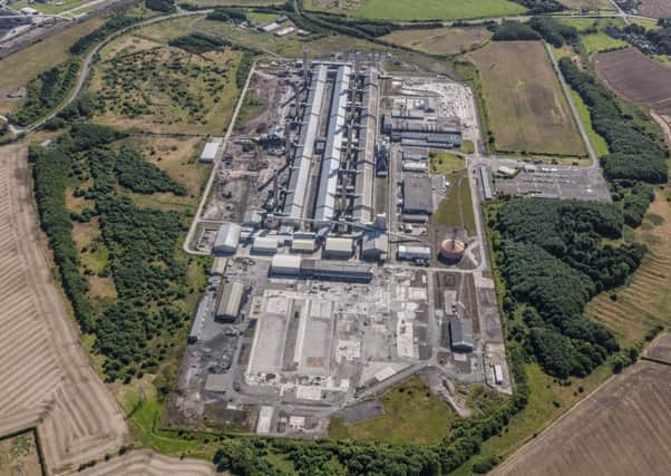 Aerial view of the Lynemouth smelter site showing the demolition of the first of four potroom buildings.