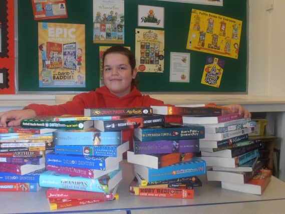 Phoebe Hayton has won Â£250 of books for the Duke's Middle School in a writing competition.