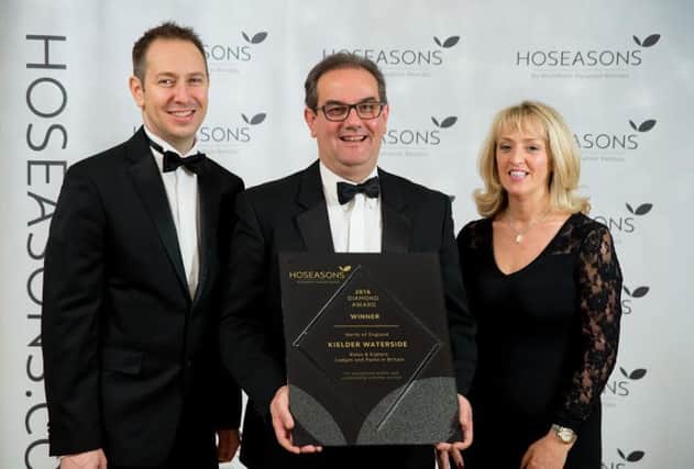 Mark Warnes, Property & Portfolio Director, Hoseasons with members of the Kielder Waterside team and their award. Picture by Darren Cool www.dcoolimages.com