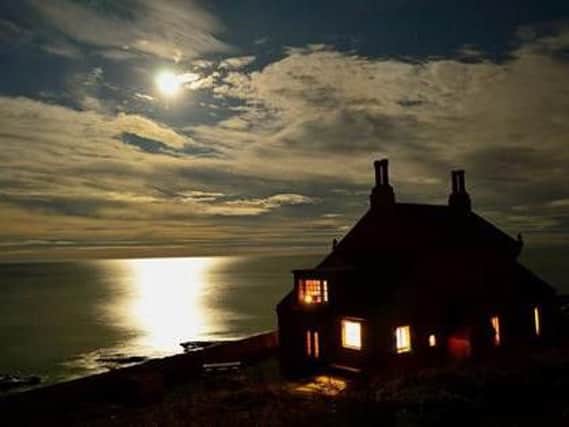 The supermoon lights up Howick Bathing House. Picture by David Wealleans