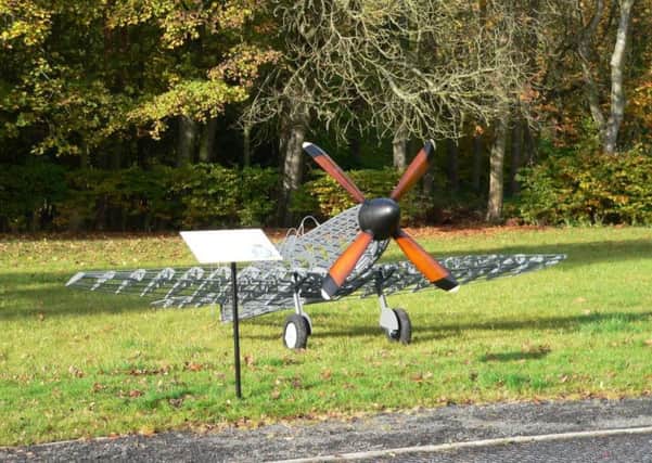 The memorial to the airmen of the former RAF Morpeth includes a half-size model of a Spitfire Mk XII and a memorial board.