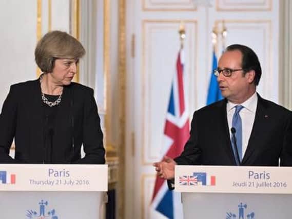 French President Francois Hollande with the Prime Minister of United Kingdom Theresa May, Shutterstock