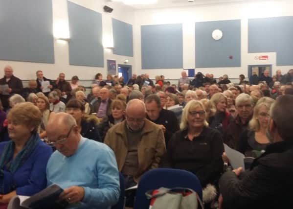 The public packed into last night's meeting.