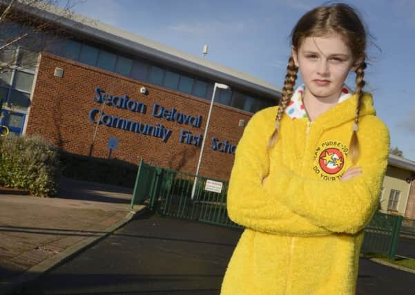 Osion Duff outside Seaton Delaval First School in her Pudsey costume.
Picture by Jane Coltman
