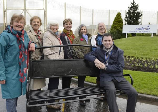 Members of Longhoughton and Boulmer Women's Institute and HMP Northumberland director Tony Wilson, with a bench produced in the prison workshops and gifted to the community.
Picture by Jane Coltman