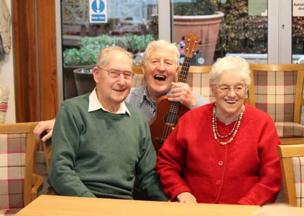 John and Edith Appleby with Singing fo the Brain volunteer Malcolm Bennett.