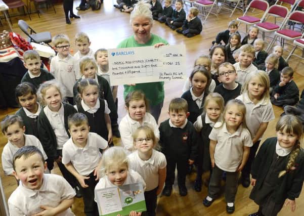 A sponsored work-out by pupils at St Paul's RCVA Primary School in Alnwick has resulted in over a thousand pounds being raised for charity. Lisa Jones of the NSPCC was delighted to attend an assembly to tell the pupils they had raised Â£1061.25.
 Picture by Jane Coltman