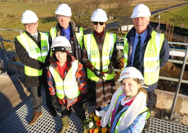 Tony Gates, chief executive of the Northumberland National Park Authority; 93-year-old Jack Hope, from Wooler, the National Parks original warden; the Duchess of Northumberland; Coun Glen Sanderson, chairman of Northumberland National Park Authority; with Henshaw Primary School pupils Reed Bryson and Chloe Makepeace, both eight.