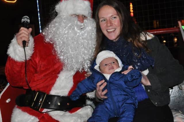 Alnmouth Christmas Lights 2016
Santa's youngest visitor, Azari James (6 weeks old) with mum, Airah Rose Young
 Picture byTerry Collinson
