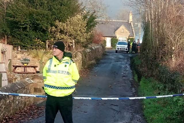 A policeman at the scene of the Lucker house fire. Picture by Jane Coltman