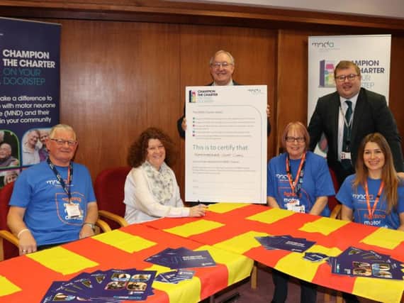 MND campaigner Colin Hardy, with Coun Susan Dungworth; Coun Grant Davey, council leader; Julie Compton, campaigns manager north for the MNDA; Coun Scott Dickinson; and Kathryn Sheldon, regional fund-raiser for the MNDA.
