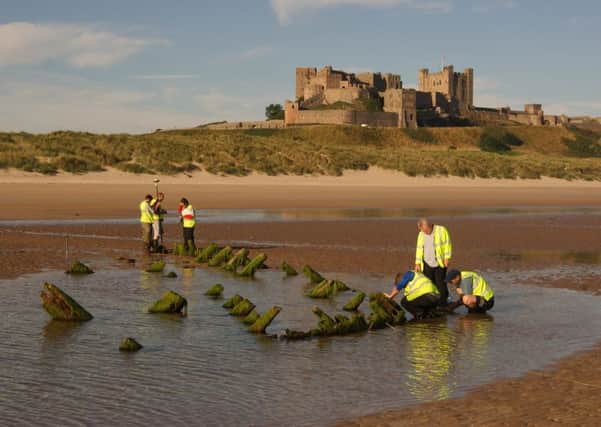 MAST staff and volunteers surveying the wreck on Bamburgh beach.