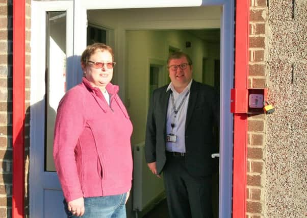 Jacqui Bexfield and Coun Scott Dickinson at the entrance to ATAC Community Hall in Widdrington Station.
