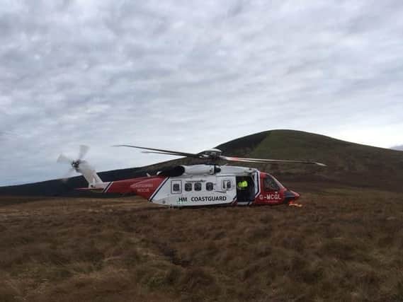 The MCA rescue helicopter at the scene on Hedgehope Hill.