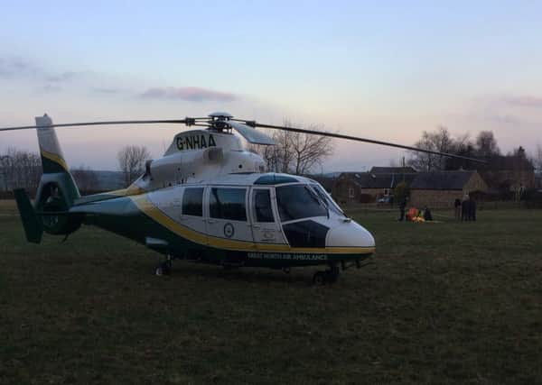 The Great North Air Ambulance Service helicopter at the scene of the incident.