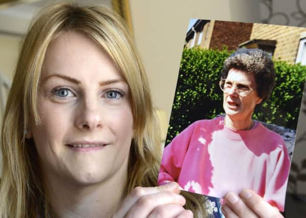 Gemma Little with a picture of her mother Anne
Picture Jane Coltman
