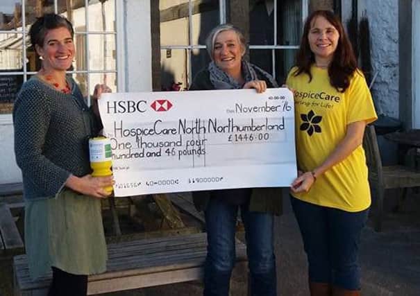 Fund-raisers at The Ship Inn present a cheque to HospiceCare North Northumberland.