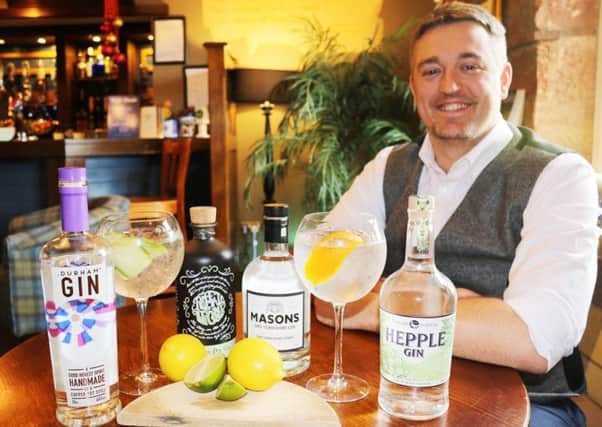 Dave Walker, of The Inn Collection Group, with the local gins on offer.