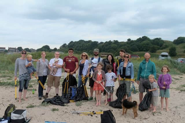Volunteers clearing litter from the beach at Alnmouth.
