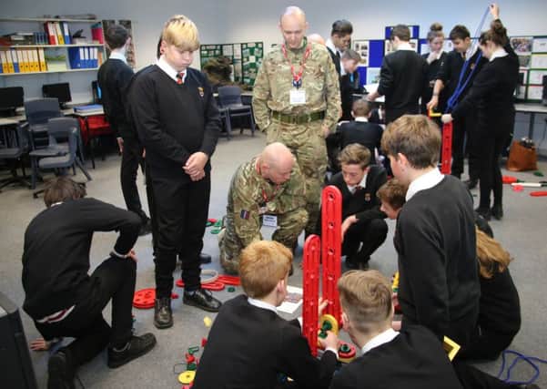 Members of RAF Boulmer's Youth Activities team with Duchess's Community High School pupils.
