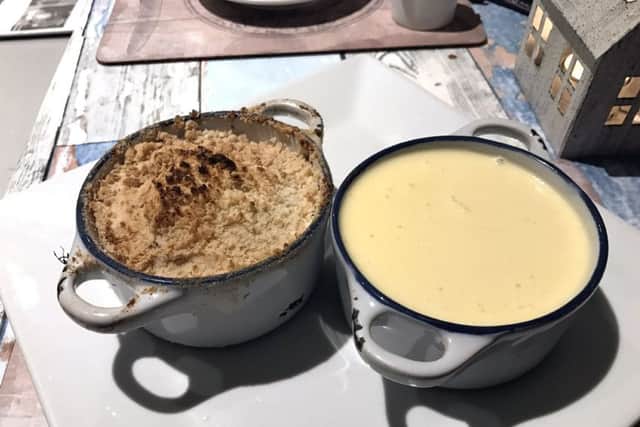 Apple, plum and ginger crumble with 'lashings of custard'