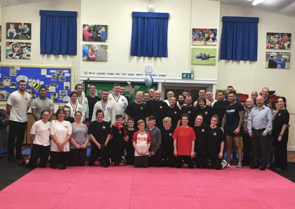 Barny Young and his daughter Rachel, both centre in second row, other instructors and students at his special final class.