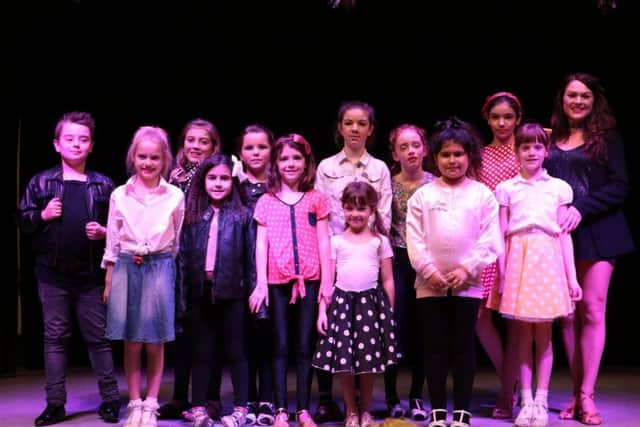 Lisa Fiddes-Dobson, pictured right, with one of her childrens classes that performed during the Night at the Movies show.