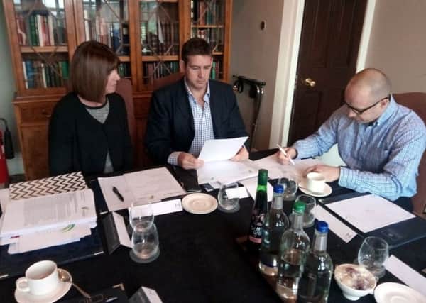 Three of the judges deliberate over the entries for the Northumberland Business Awards at Linden Hall.