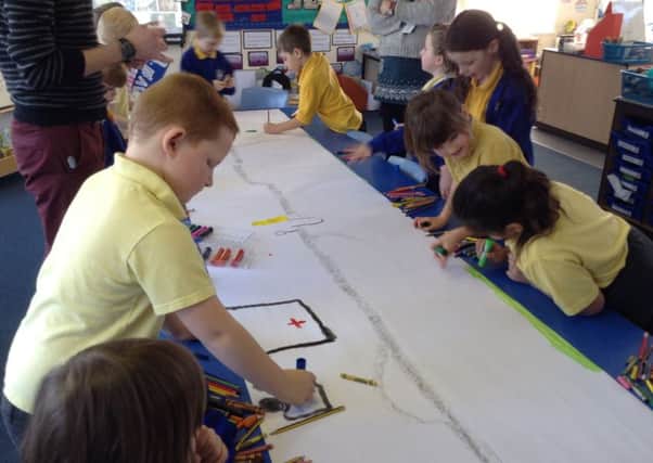 Pupils at St Michael's CE Primary School at work on the trail map.