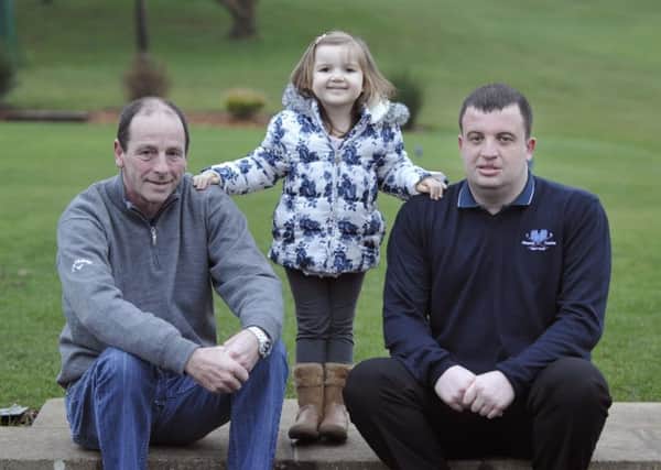 Event sponsor Kevin Murphy and Alnwick Castle Golf Club manager Daniel Harrison with Evie Campbell.
 Picture by Jane Coltman