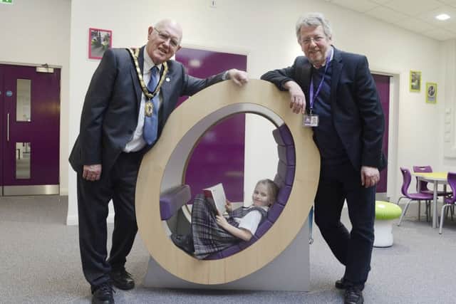 Annabel Samuels with Mayor Alan Symmonds and Chairman of governors Bill Grisdale in the new library at the official opening of the extension at Swansfield Primary First School.
 Picture by Jane Coltman