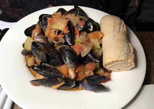 Black-lip mussels, rich tomato provencale sauce and crusty bread at the Northumberland Arms, Felton.