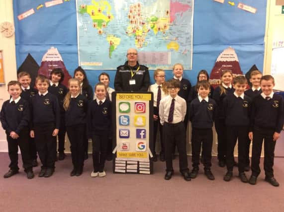 PC Alan Morton with pupils at Seahouses Primary School.