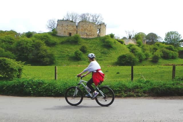 Cycling past Mitford Castle on the Morpeth and Hartburn loop.
