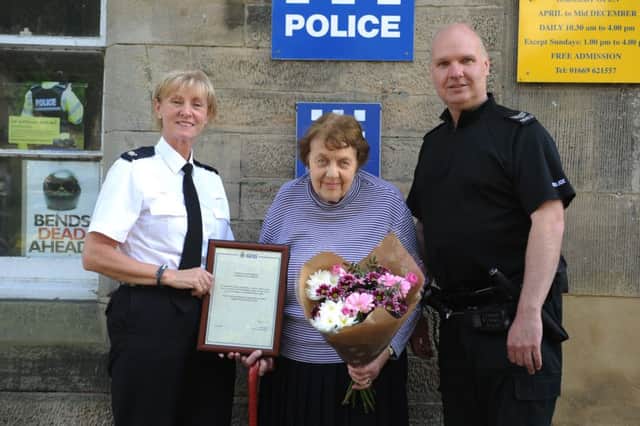 From left: Chief Superintendent Sharon Scott, volunteer Elizabeth Clifton and Sergeant Graham Vickers. They are pictured in 2015 during a presentation to Elizabeth, to recognise her work as a police volunteer.