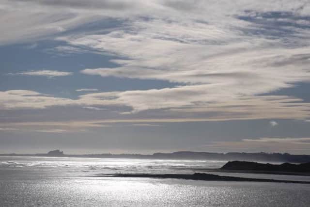 Bamburgh from Holy Island by Jean Sawyer.