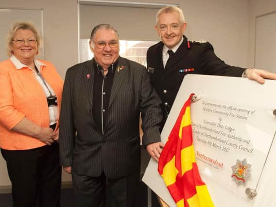 Couns Liz Simpson and Dave Ledger and Chief Fire Officer Paul Hedley with the official opening plaque.