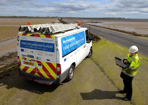 An Openreach engineer surveying on the causeway to Holy Island as part of the iNorthumberland programme.