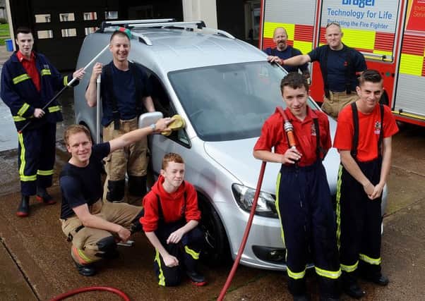 The fund-raising car wash at Alnwick Fire Station. Picture by Steve Miller