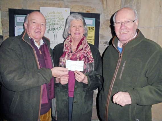 Mrs Jo Jackson, organiser for Warkworth and Acklington of The Children's Society, receives a cheque for Â£200 from Rotarians Fred Calvert, right, and Derek Conway who presented the donation recently on behalf of the Rotary Club of Amble and Warkworth, which raised the money from the club's annual Christmas Collection.