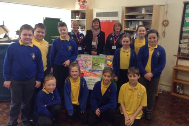Pupils from St Michael's CE Primary School in Alnwick with the books donated by the town's WHSmith store.