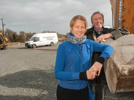 Coun Kate Cairns and Coun Ian Swithenbank in the new car park under construction at High Newton.