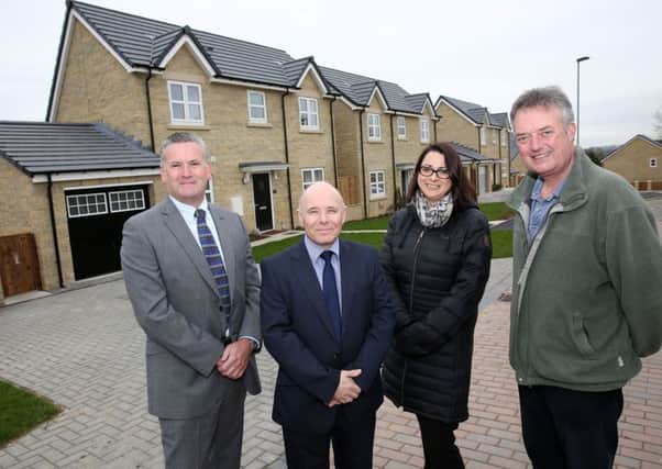 Andy McLeod and Peter Gilmore, of Tolent Living, with Louise Stewart, of Silverstone Building Consultancy, and Nick Dawe, of Lindisfarne Homes, at the newly-completed Thomas Percy Close development in Alnwick.
