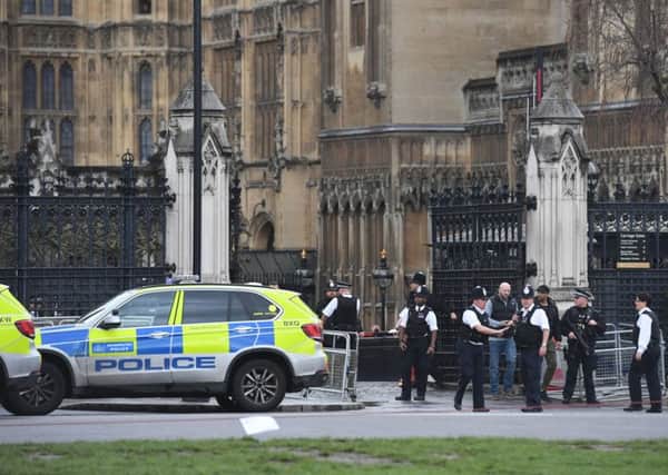 Police close to the Palace of Westminster, London. Picture by Victoria Jones/PA Wire