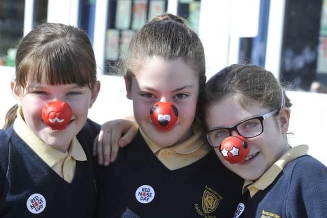 Teachers and staff from Newminster and Chantry Middle Schools in Morpeth put on their dancing shoes on in support of Red Nose Day 2017.
 Three of a kind: Nieve, Chloe and Rose.
 Picture by Jane Coltman