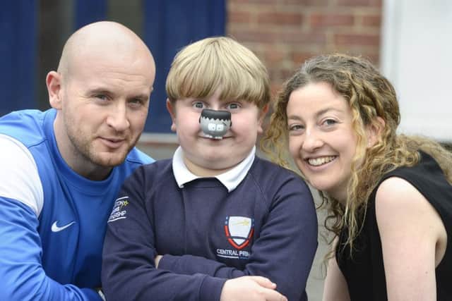 Callum Sanderson, 8, with his special  Frankinose and Central Primary School PE teacher John-James Smith and Class teacher Katherine Broady.
 Picture by Jane Coltman
