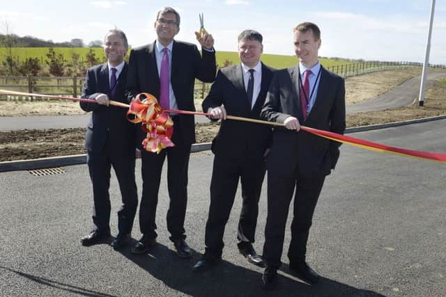 David Laux, Steve Mason and Paul Jones from Northumberland County Council with Dave Bennett from Carillion (second right) at the official opening of the Â£30million Morpeth Northern Bypass.  Picture by Jane Coltman