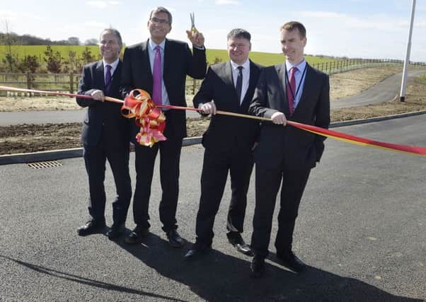 David Laux, Steve Mason and Paul Jones from Northumberland County Council with Dave Bennett from Carillion (second right) at the official opening of the Â£30million Morpeth Northern Bypass.  Picture by Jane Coltman