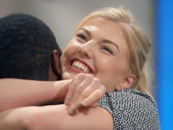 A delighted Lorna hugs fellow contestant Fumbi as they both go through to the knock-out stage.