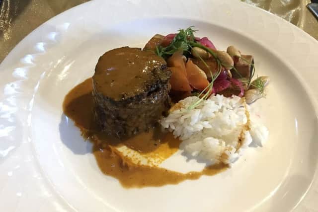 Coconut curry braised beef short rib, carrot and coriander puree, macerated onion and peanut salad with jasmine rice.